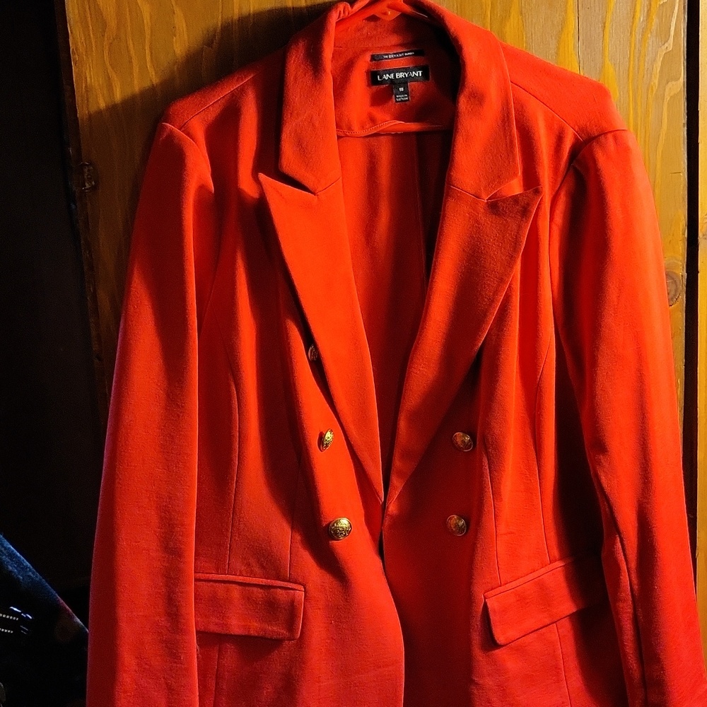 Red blazer with gold buttons and small front pockets